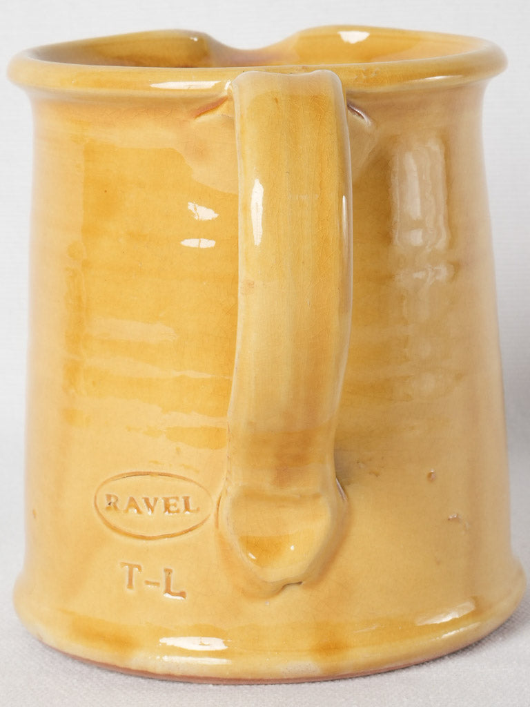 Earthy ocher-glazed handcrafted terracotta pitcher