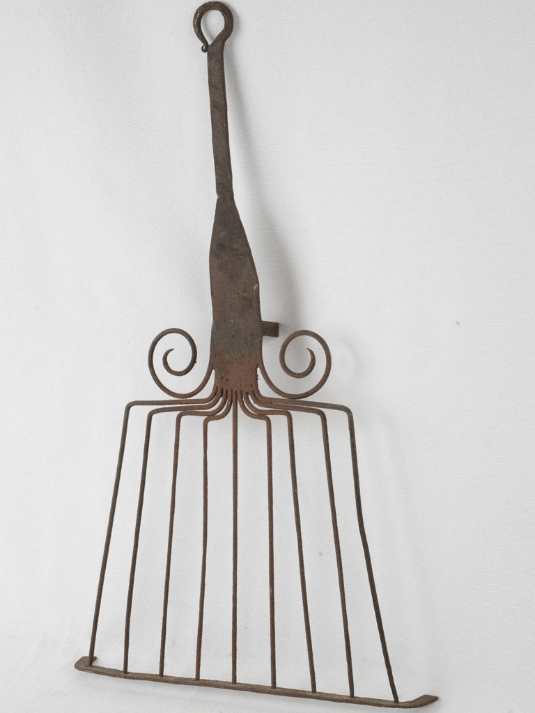 Charming antique iron cooking tool