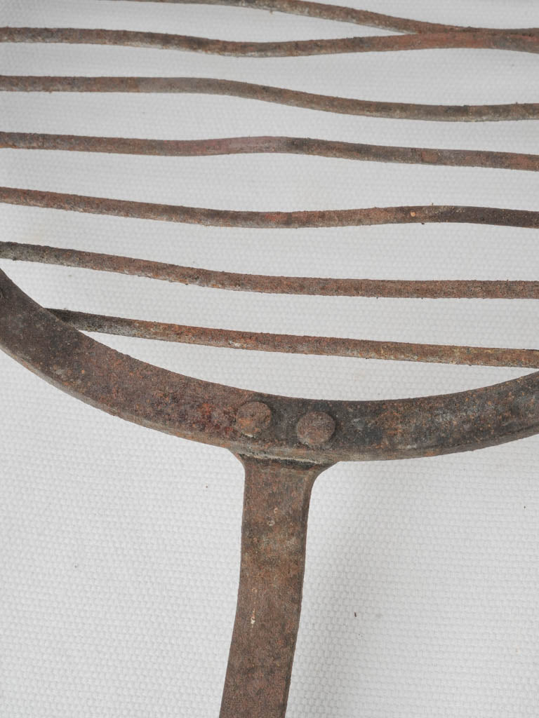 Antique, aged round oven cooking grill