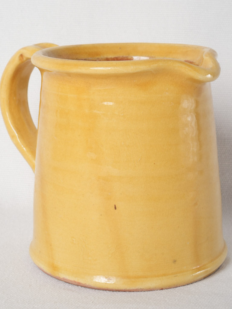 Antique ocher-glazed terracotta pitcher