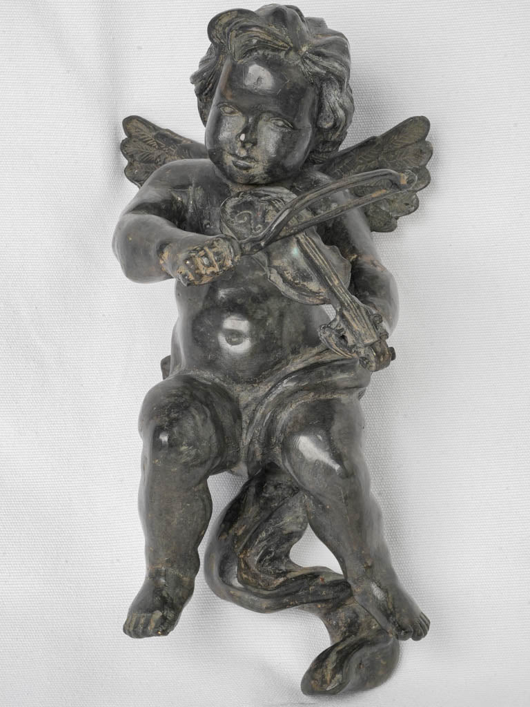 Antique winged cherub figure statue