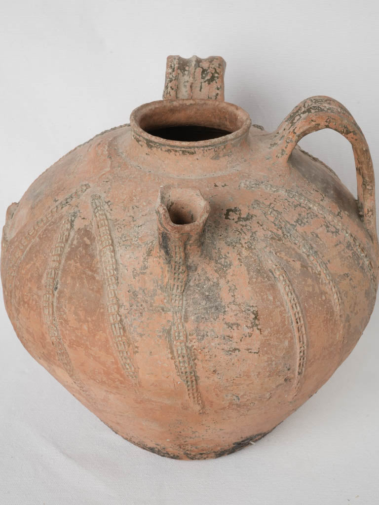 Ancient, rustic terracotta water vessel