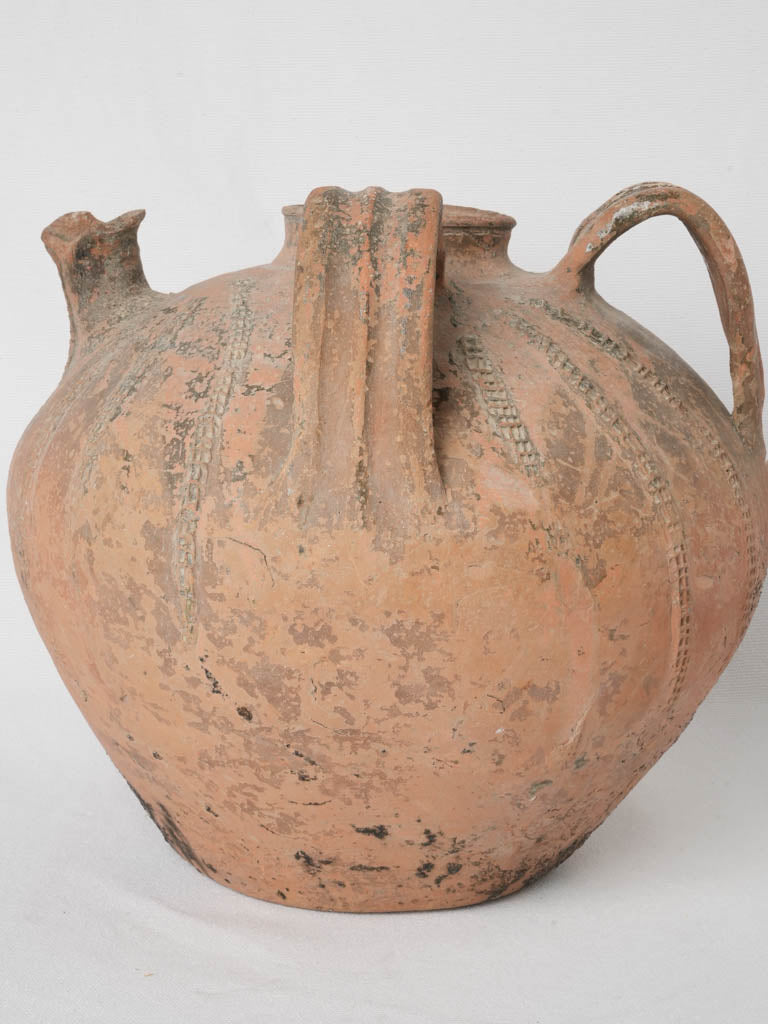 Aged, rustic terracotta water pot