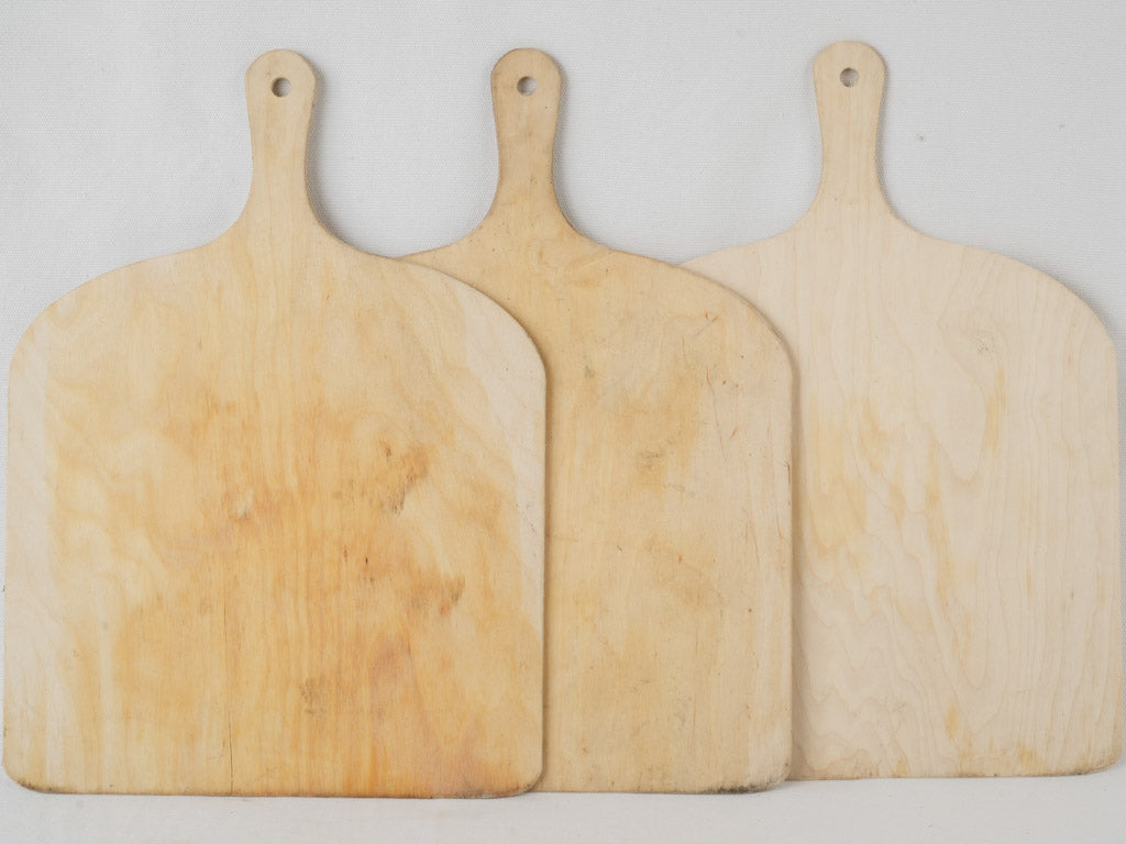 Weathered shovel-shaped pizza trays