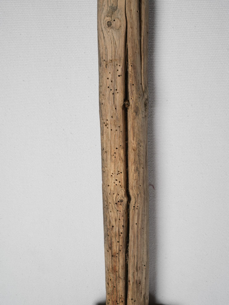 Time-worn decorative wooden cooking paddle