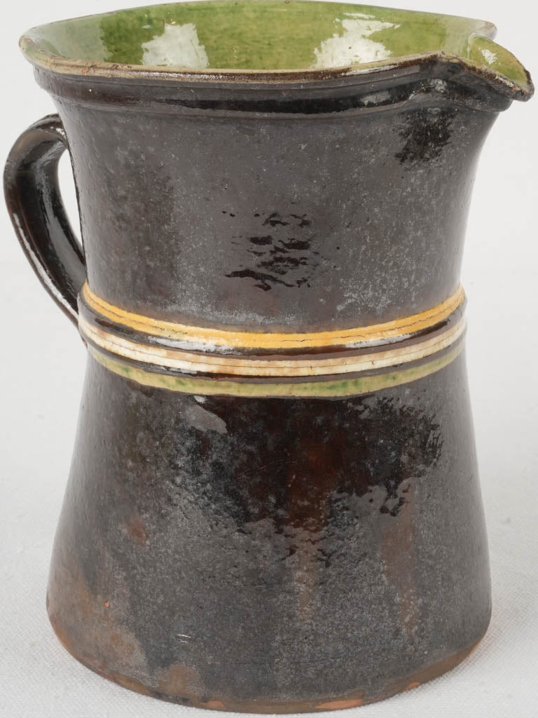 Timeworn antique earthenware pitcher