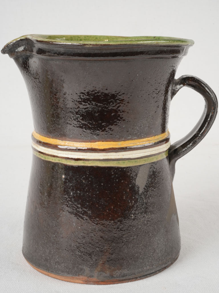 Late-century brown water pitcher