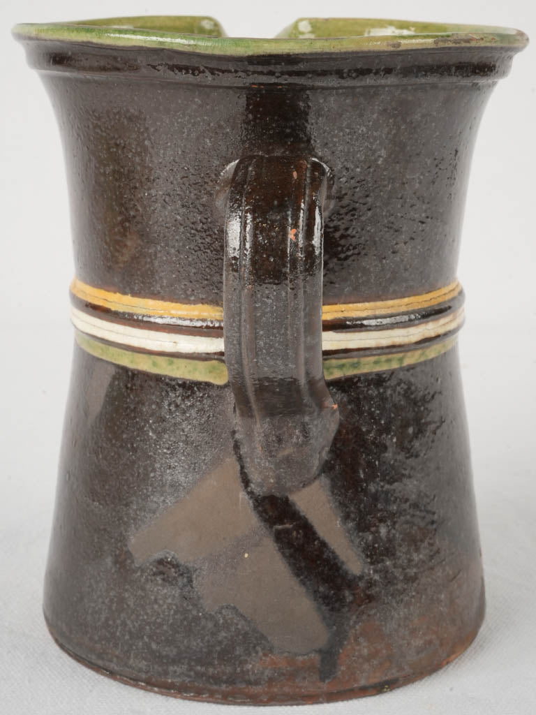 Aged black-green serving jug