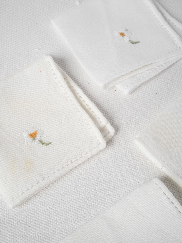 Delicate miniature floral napkins in white