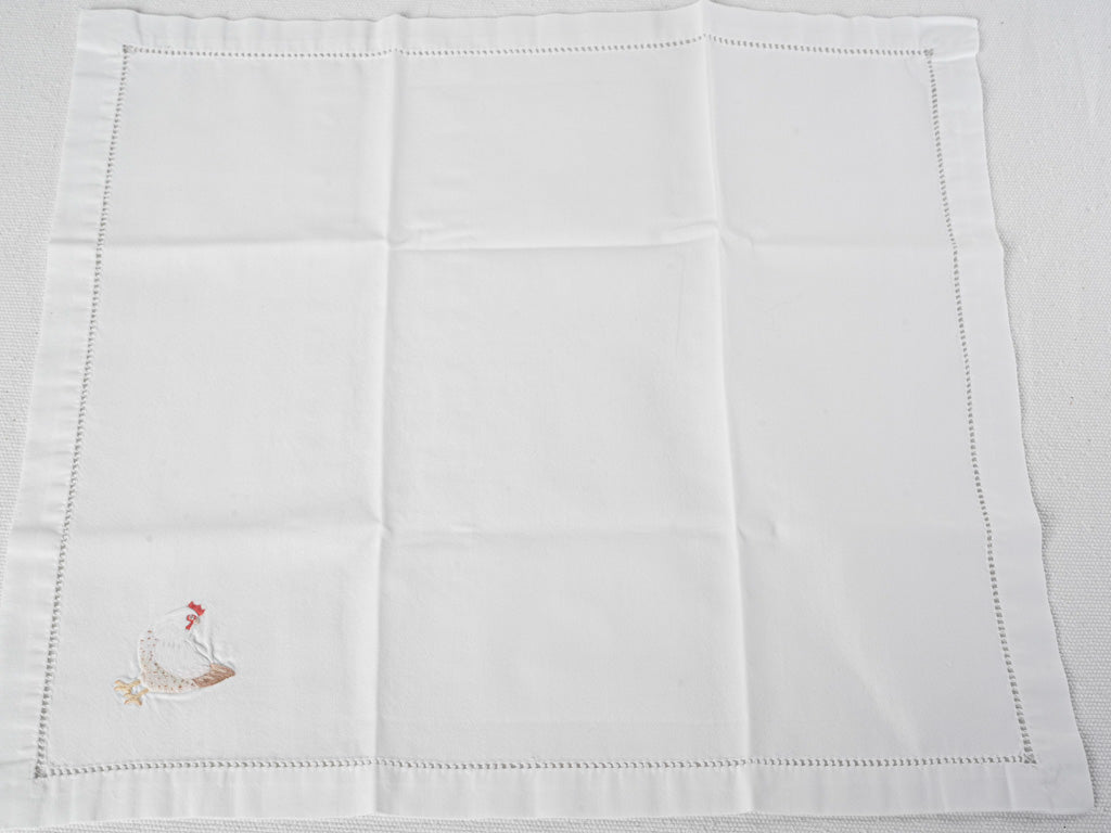 Timeless hemstitched hen motif napkins