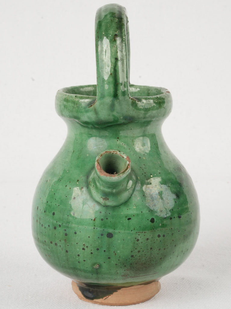 Distressed speckled green glazed cruche  