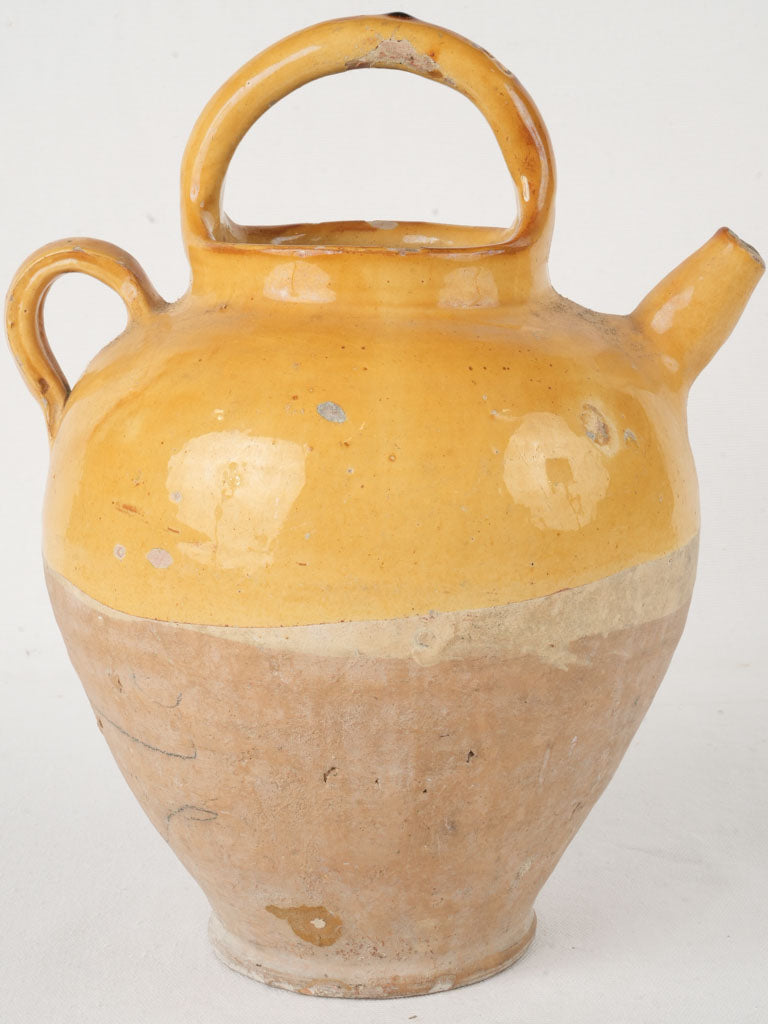 Ochre-glazed historical pottery jug  