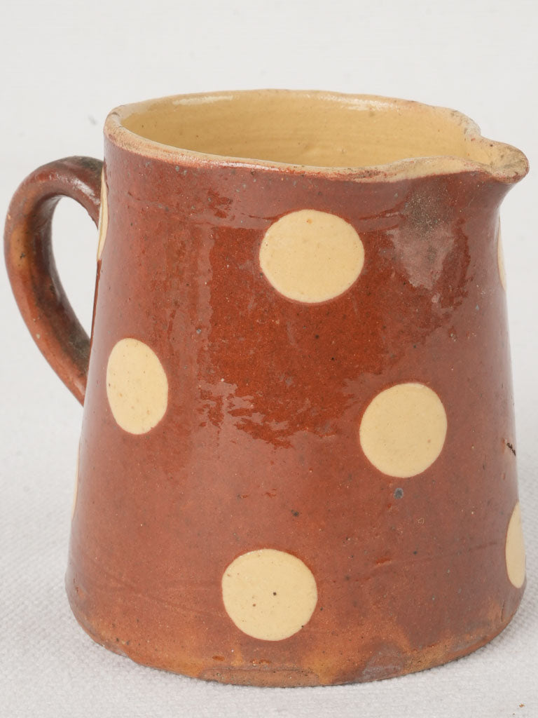 Rustic maroon glazed ceramic creamer  