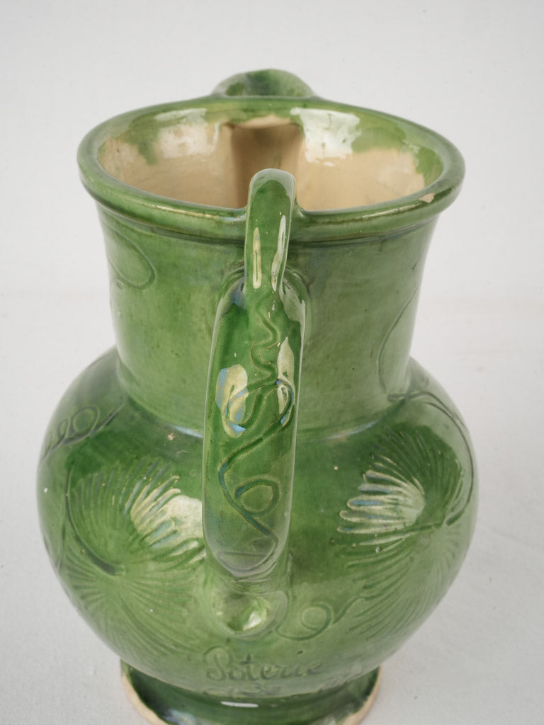 Traditional green ceramic pitcher