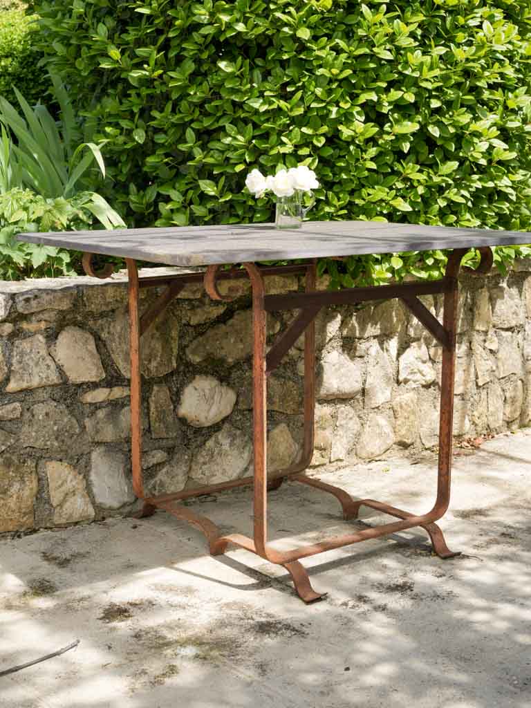 Rustic wrought iron top garden table