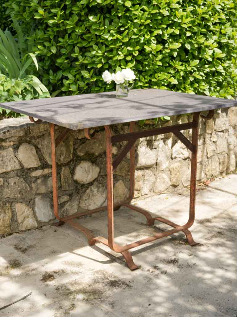 Aged stone top outdoor dining table