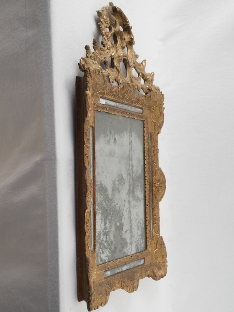 Age-worn, ornate Louis XV mirror