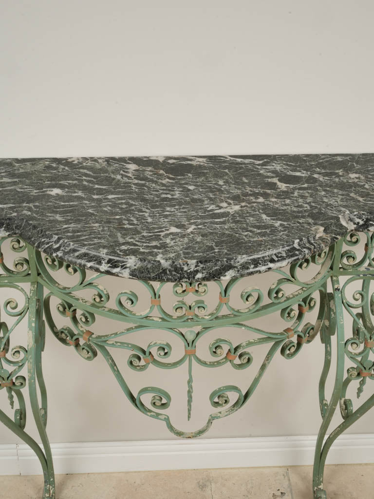 Gracefully scrolled ironwork console