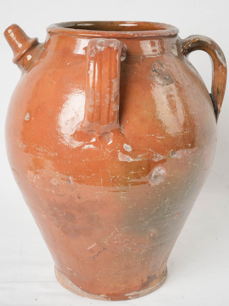 Ochre-toned ceramic wine container  