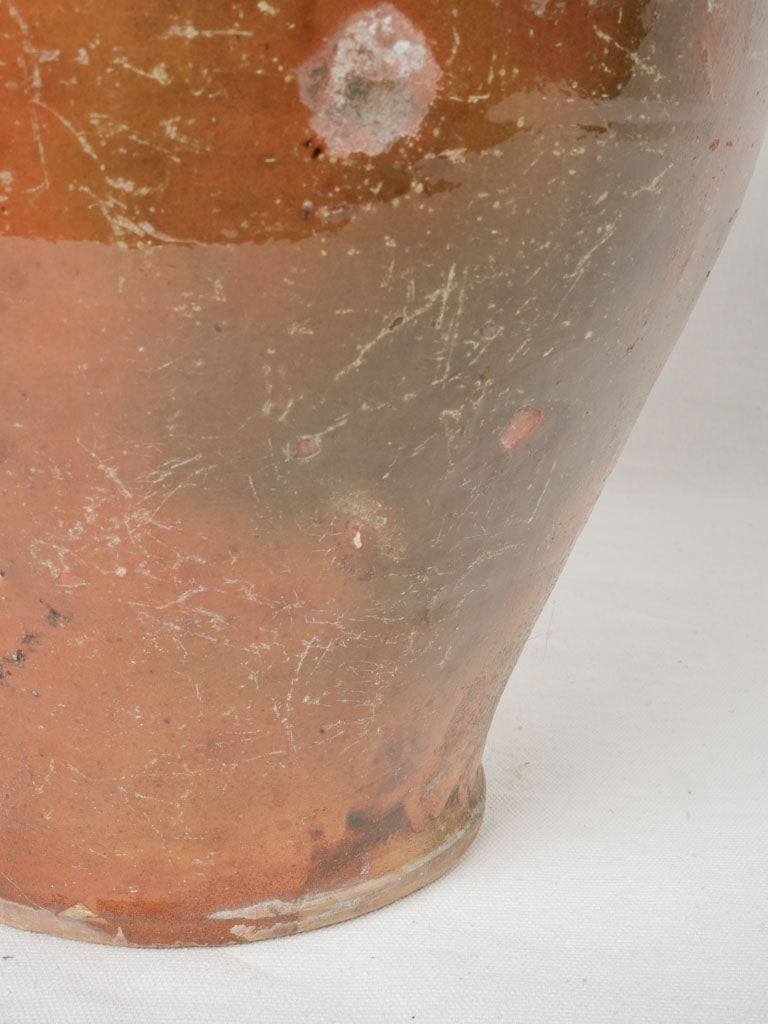 Timeworn ochre terracotta jar  