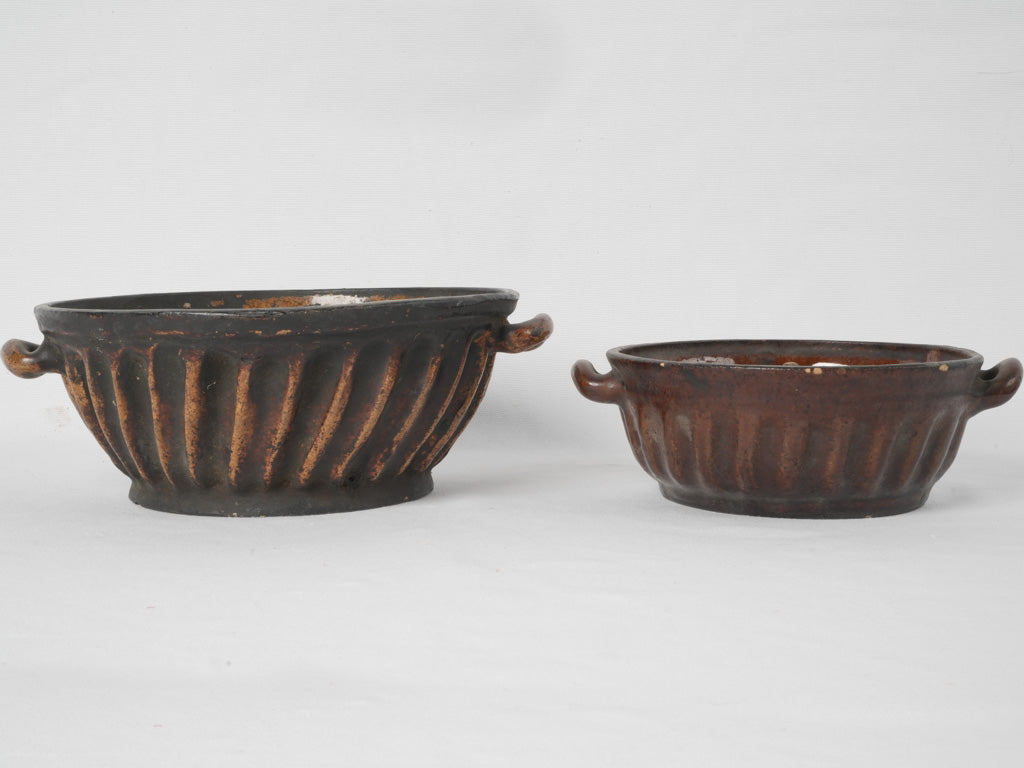 Two antique French sandstone bundt pans