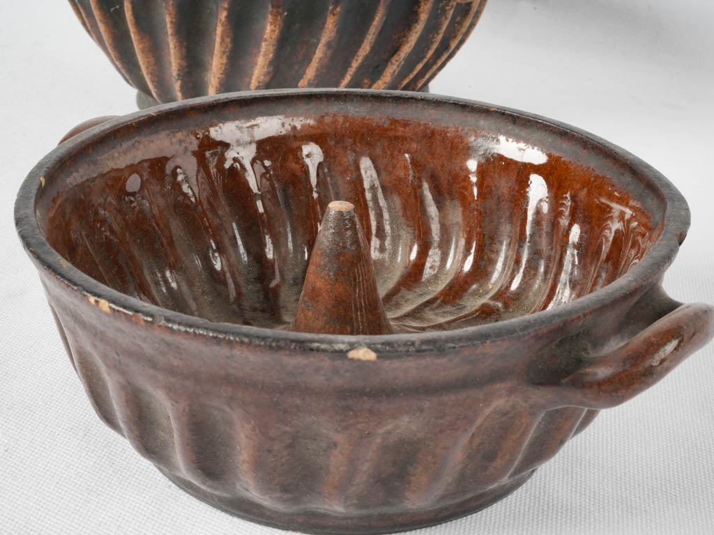 Two antique French sandstone bundt pans