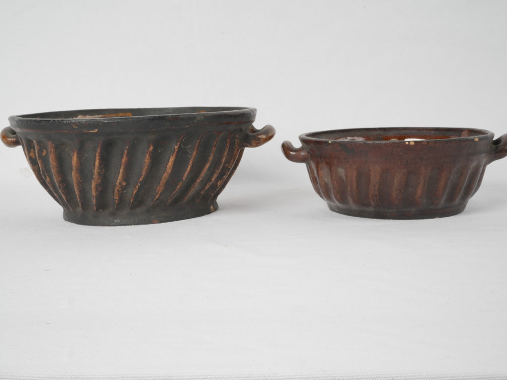 Two antique French sandstone bundt pans