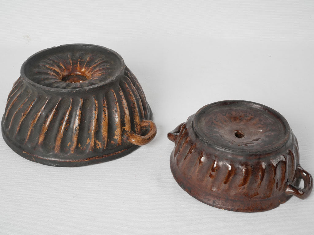 Two antique French sandstone bundt pans