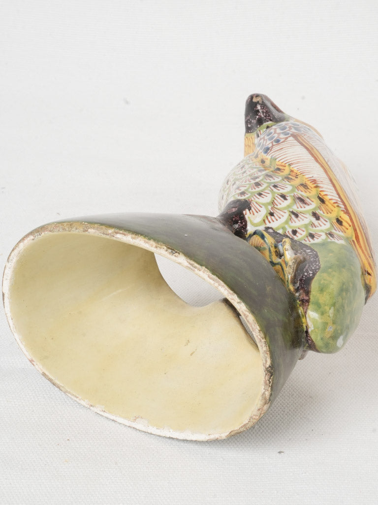 Distinctive historic ceramic parrot statue