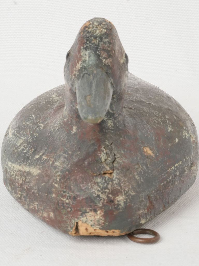 Timeworn black patina duck decoy