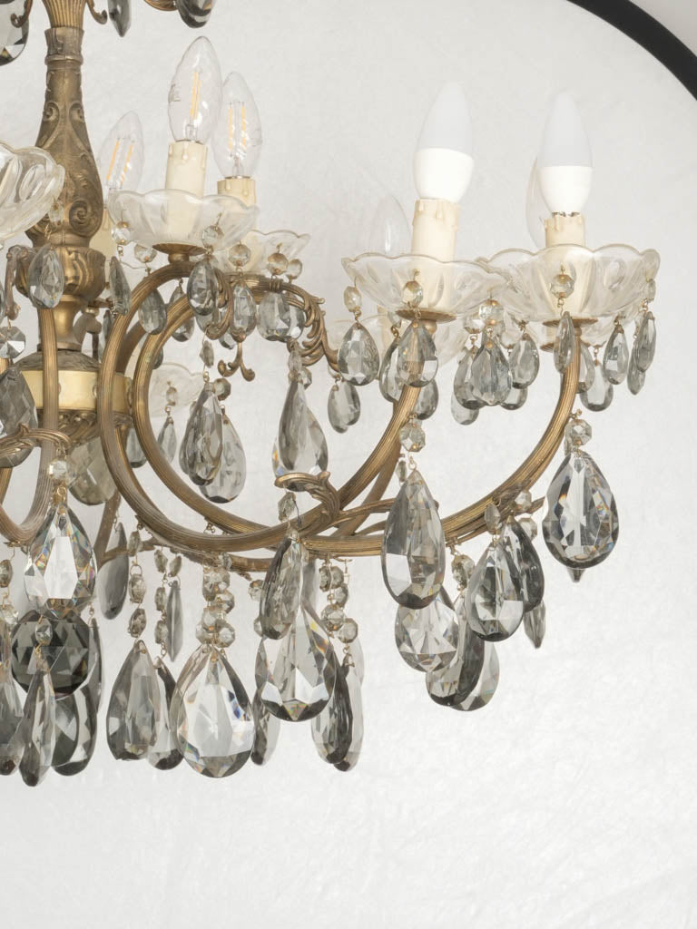 Broad two-tiered bronze ornate chandelier