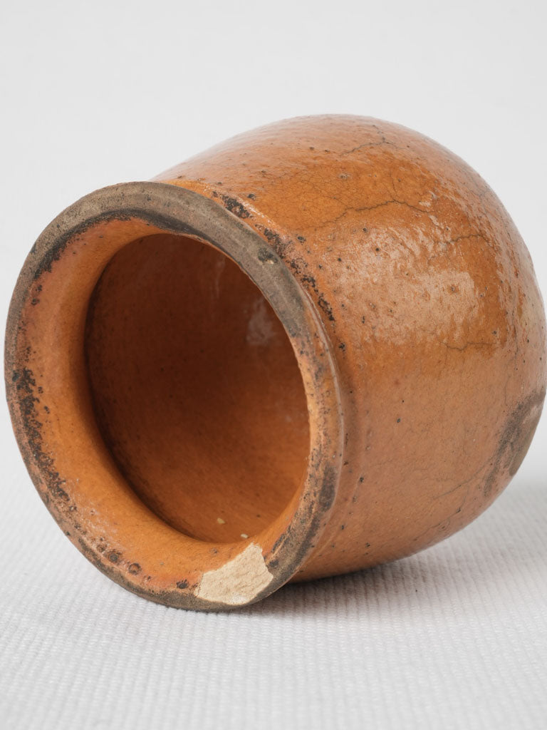 Handmade ocher-glazed honey pot