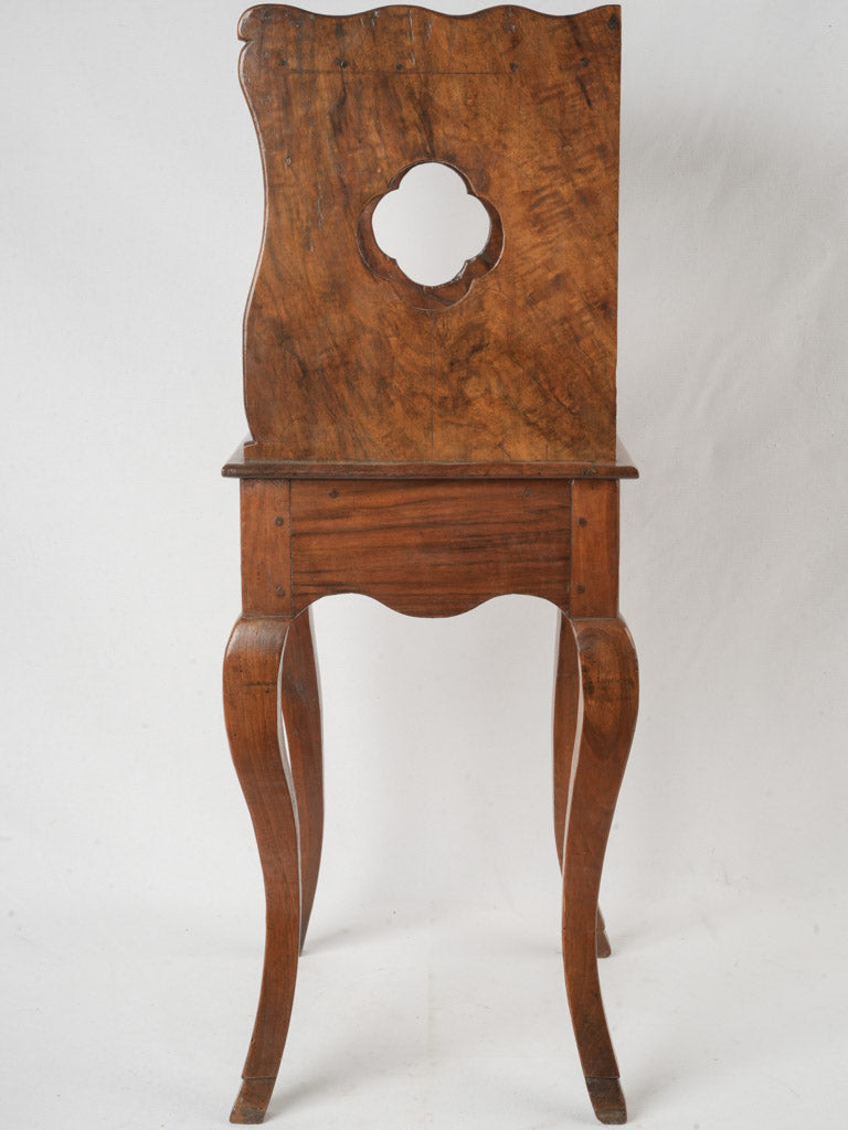 Ornate walnut high bedside table