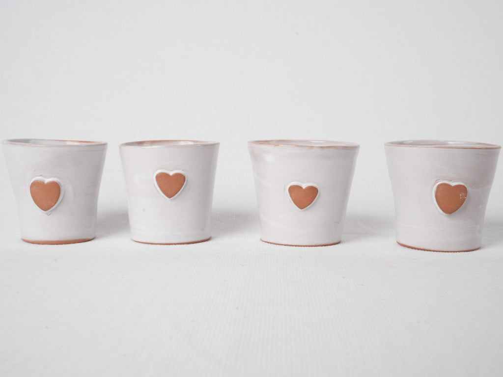 Artisanal heart-embellished pottery espresso set