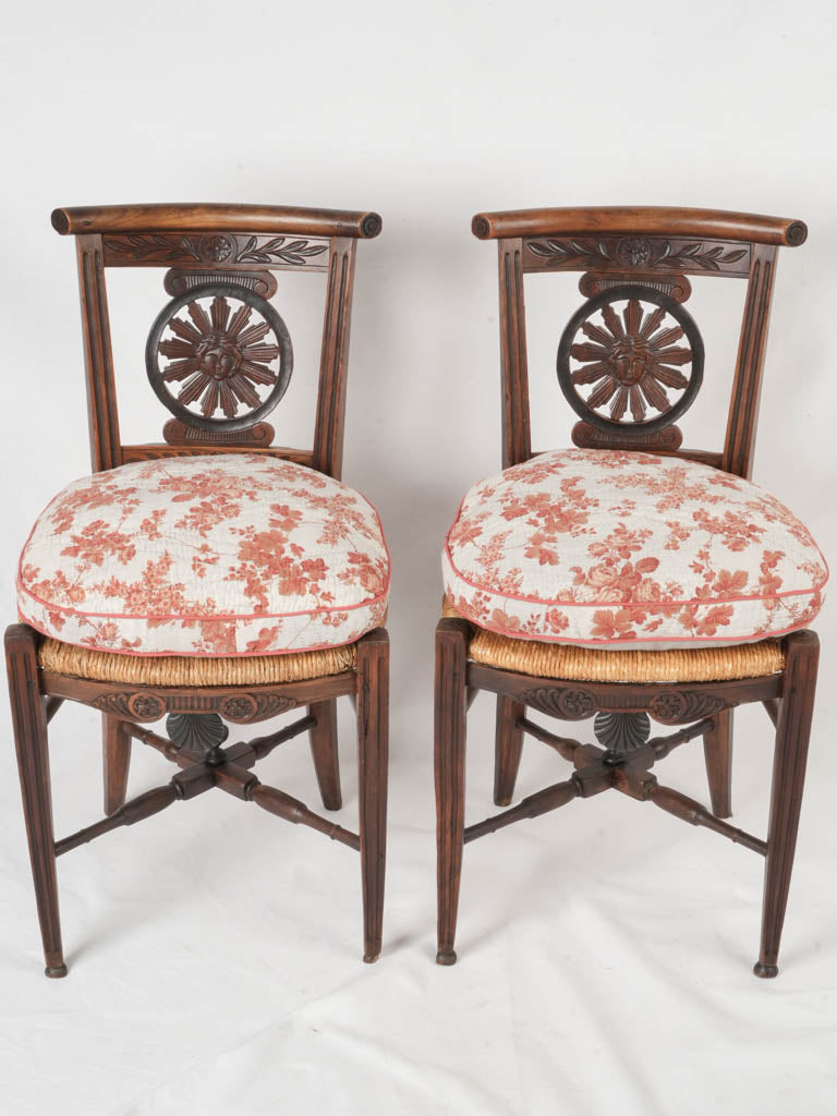 Ornate sunburst motif wooden chairs