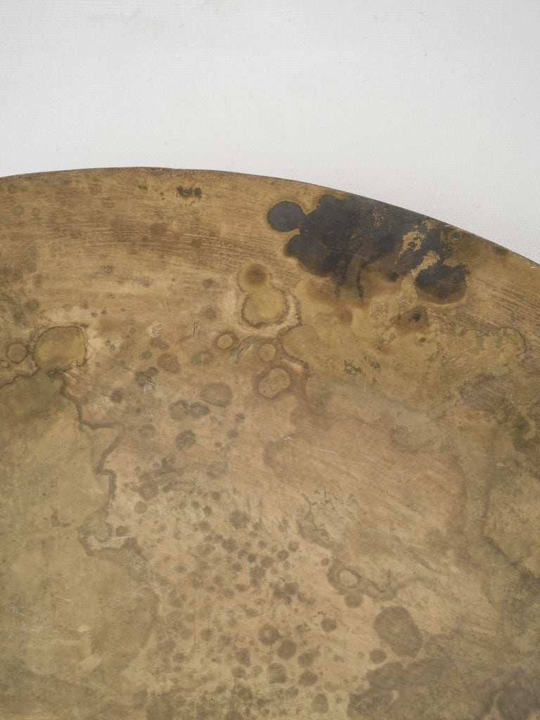 Earthy moon-like brass plate