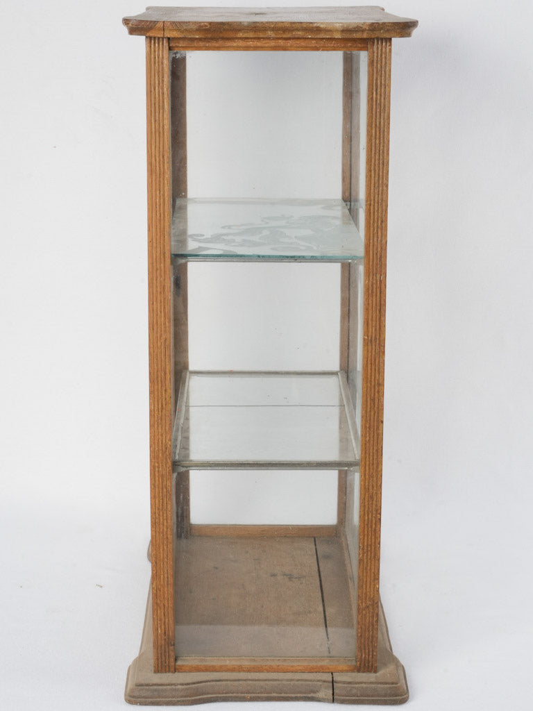 Timeless antique glass-paneled display cabinet