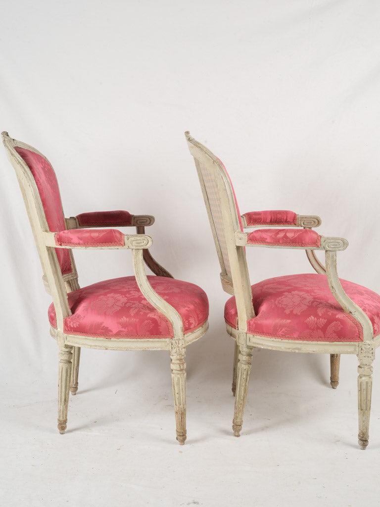 Historic magenta silk-upholstered seating  