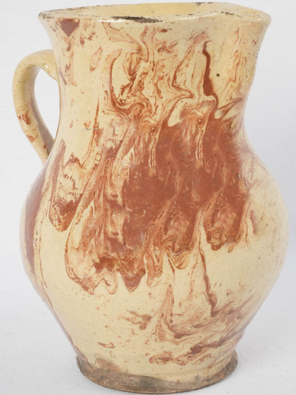 Coastal yellow and brown pottery pitcher