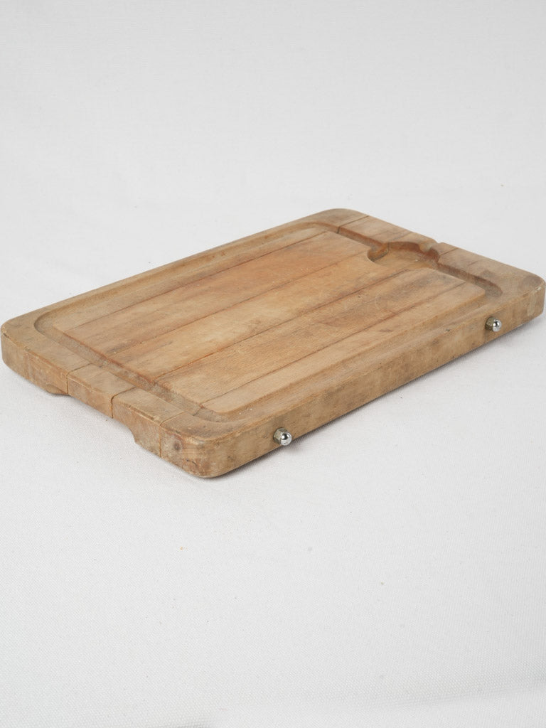 Aged French cutting board with jus well