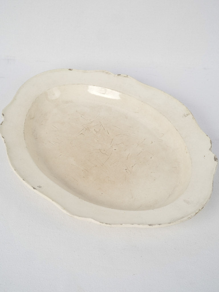  Nineteenth-century, well-loved, earthenware serving platter