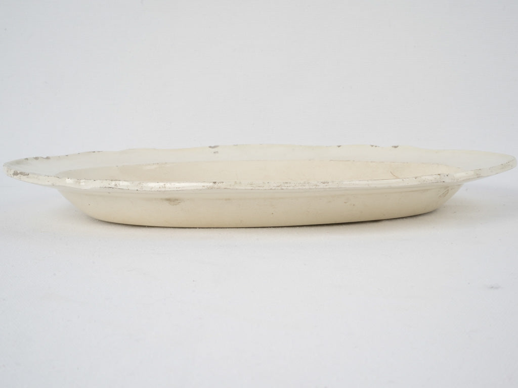  Nineteenth-century, well-loved, rustic, earthenware platter