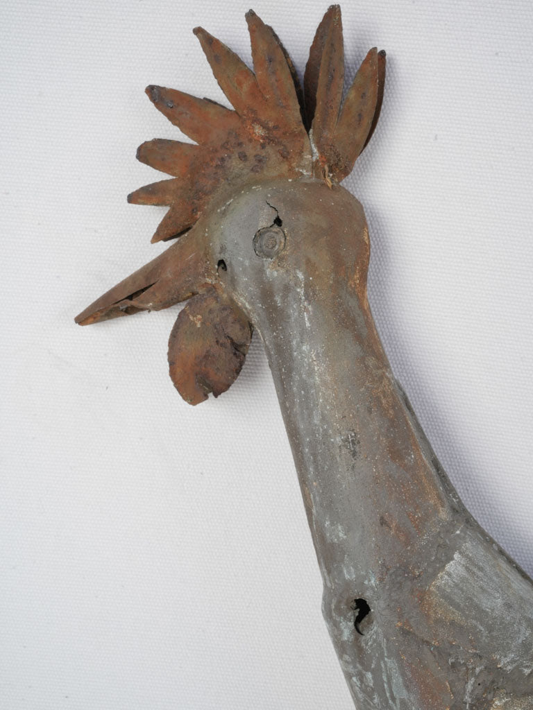 Aged, weather-beaten iron weathervane rooster