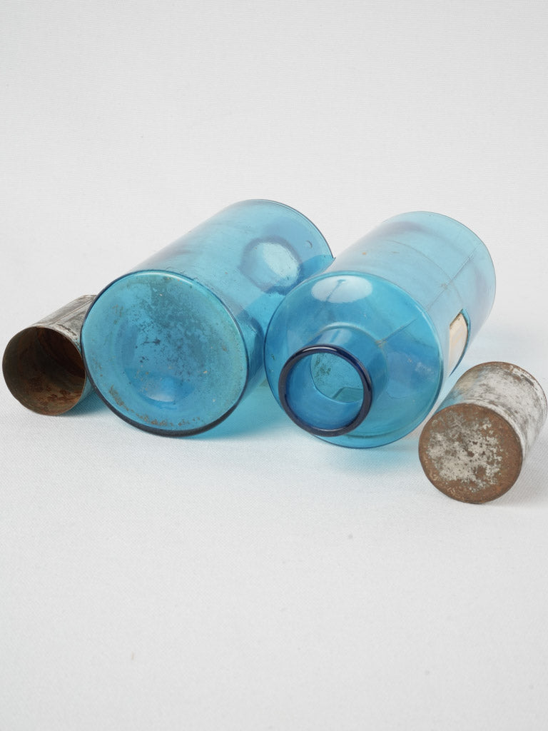 Aged blue glass apothecary containers