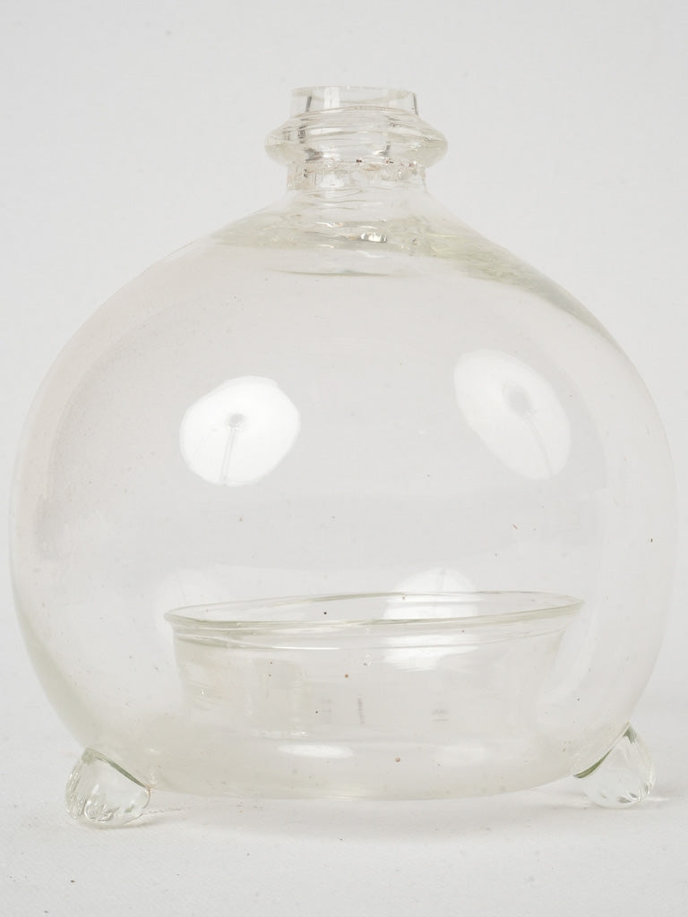 Clear mouth-blown glass insect trap