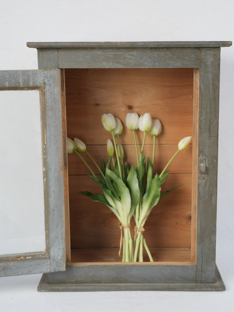 Aged wooden pharmacy collectibles display