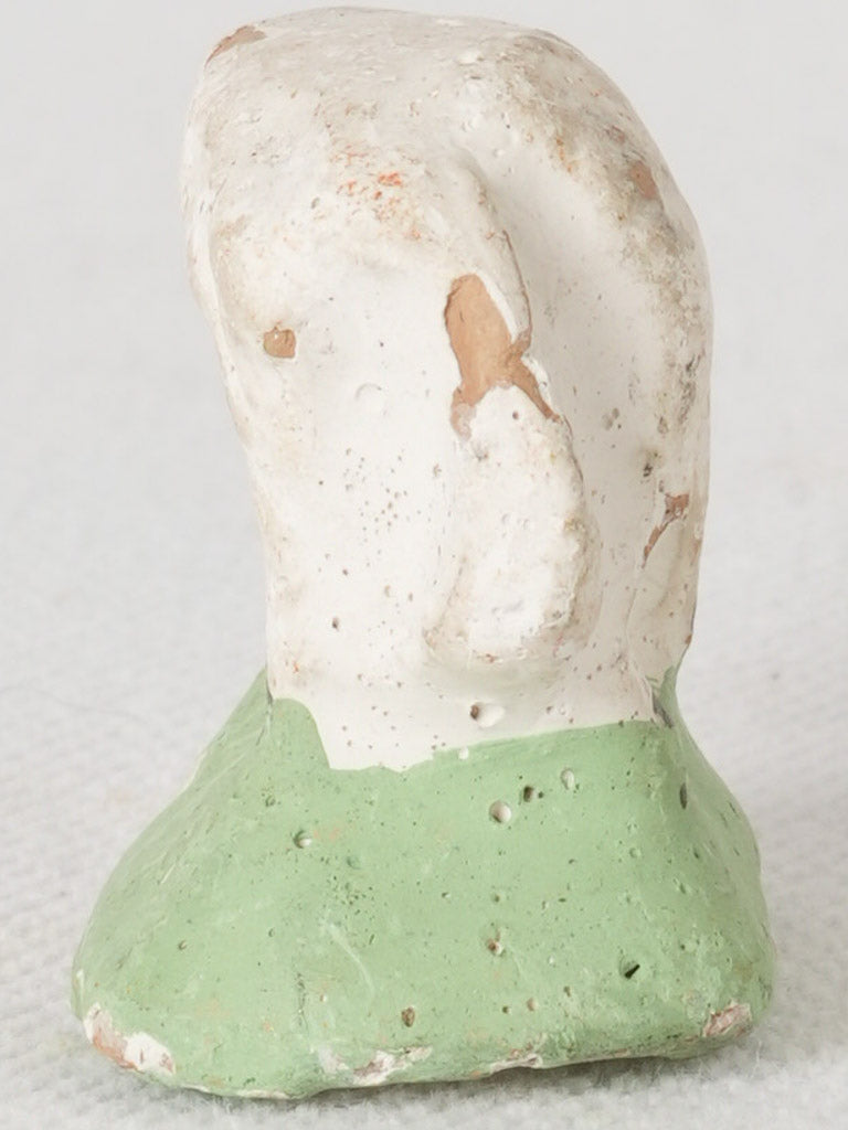 Ochre-hued clay lamb figure