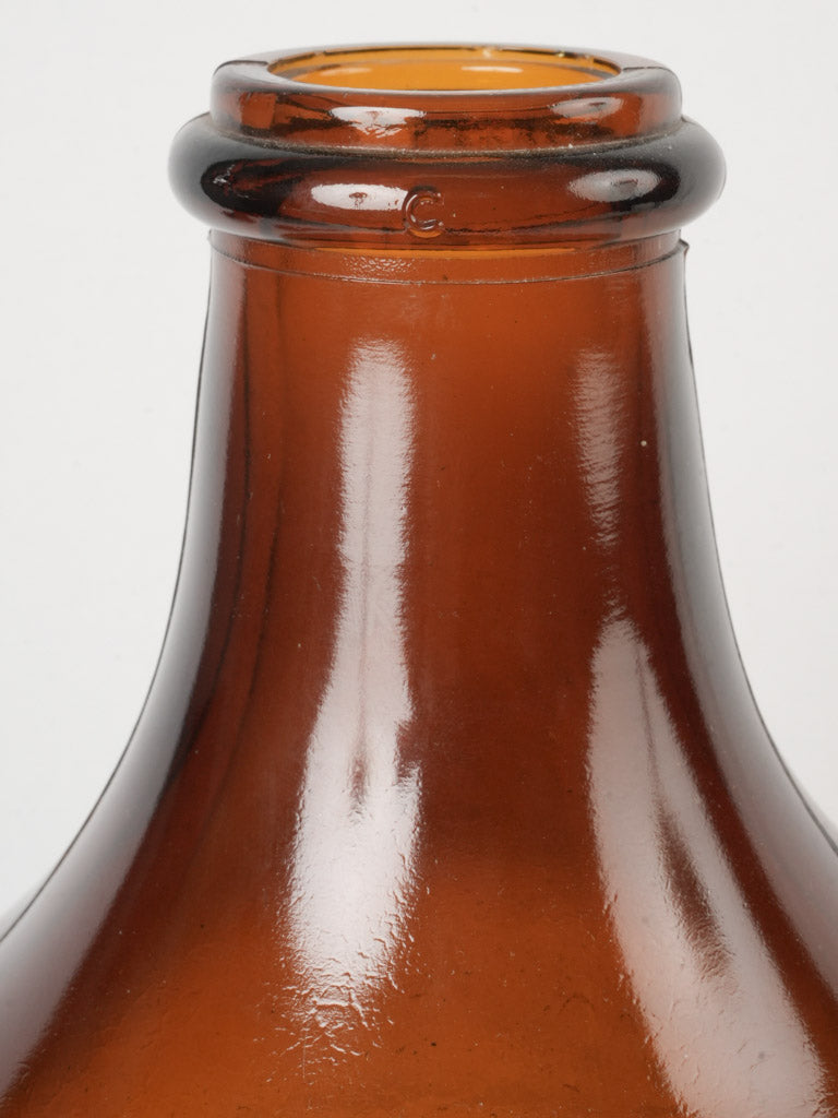 Rustic amber-hued glass bottle.