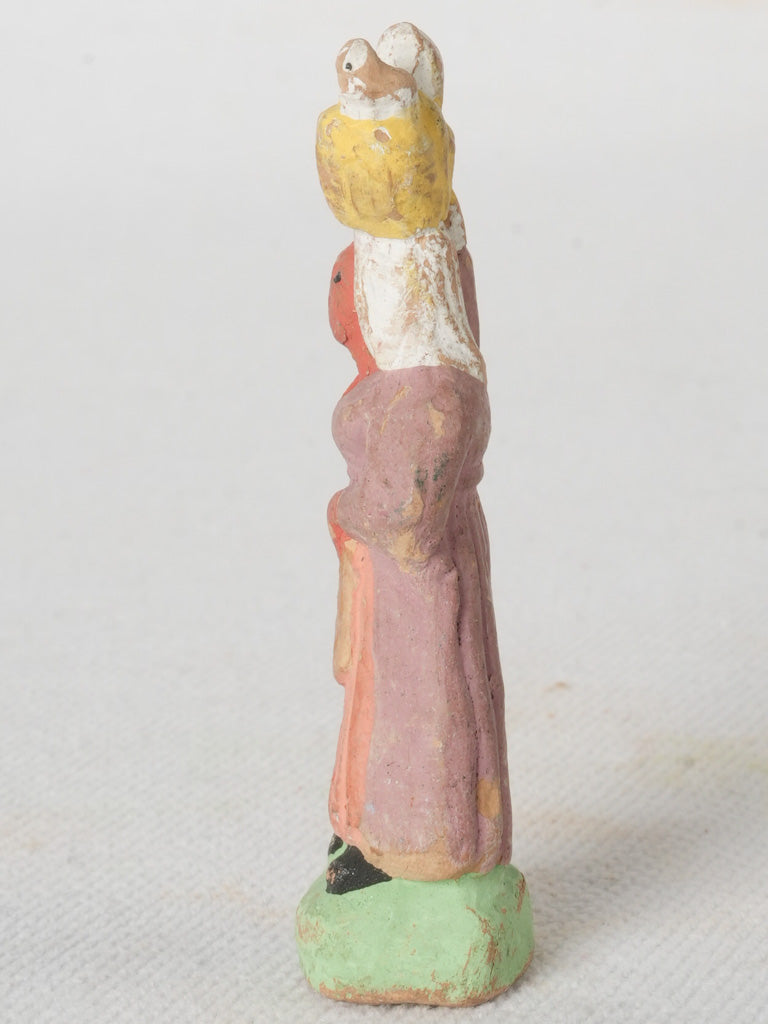 Intricate Basket-Holding Figurine