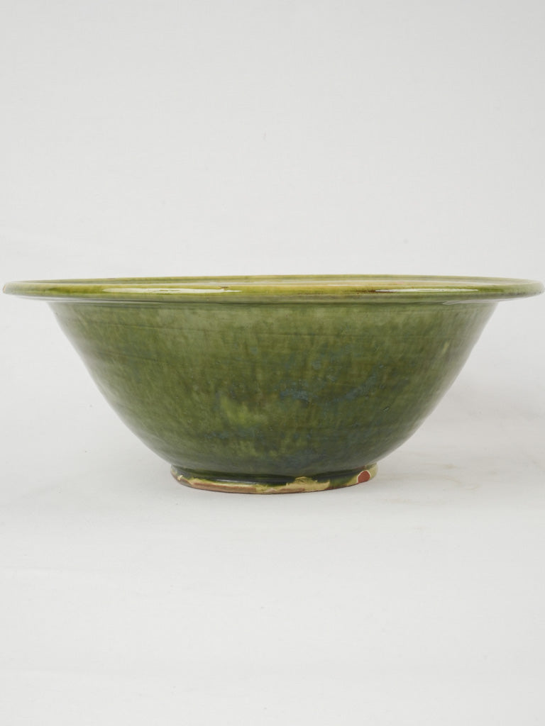 Artisanal green-glazed ceramic serving bowl